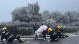 Brave Chinese firefighters navigate icy terrain to rescue stranded newborn in frozen mountain