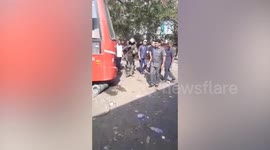 Bomb squad removes suspicious object thought to be a live bomb from parked bus