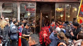 Chinese lion dancers bless restaurants and shops in London’s Chinatown for Chinese New Year