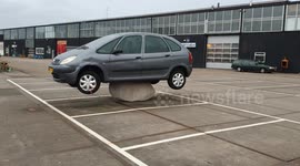 Worst parking ever? Car miraculously mounted on large rock in Amsterdam