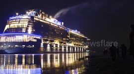 Time-lapse of cruise ship navigating narrow river at night