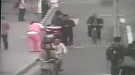 Police and pedestrians help pregnant woman give birth to baby on road