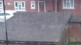 Brief but powerful rainstorm hits Hoxton, London, UK