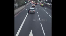Skateboarder dragged by car on London road