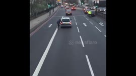 Skateboarder dragged by car on London road