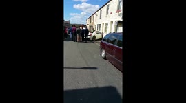 Ferrari crumples after hitting wall in front of house in Burnley, UK