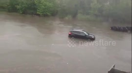 Car trapped by flooding in Houston, Texas