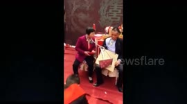 Groom's parents chained together at wedding