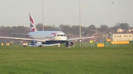BA taxis past stricken plane at LBA