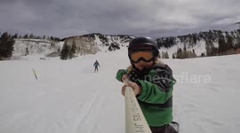Four-year-old snowboarder hits rails, jumps and cliffs