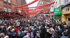 Huge crowds turn out to see the annual Lion Dance in Chinatown in London to celebrate Chinese New Year.