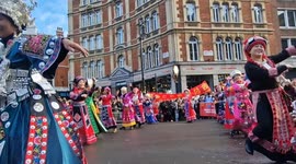 Folk dancers in London's Chinese New Year Parade groove to Dancing Queen by Abba