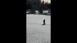 Mother Drags Sleepy Boy on Ski Slope