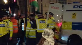 A woman is arrested on suspicion of inviting racial hatred during the 'Stop the War' emergency protest outside of Downing St