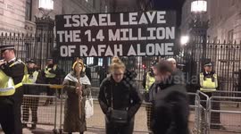 Protesters hold pro-Palestine banner outside Downing Street as Israel targets Rafah
