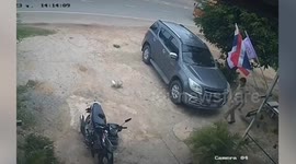 Pillion passenger falls while trying to ride on back of motorcycle