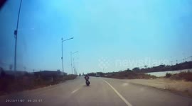 Pick-up truck crashes into street light when motorcycle suddenly switches lane