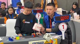 Young prodigy solves Rubik's cube in under 5 seconds