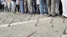 Police use water jets, tear gas, and road spikes to prevent protesting farmers from reaching Delhi