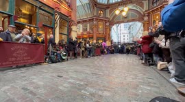 Londoners cheer on contestants at Leadenhall Market pancake race