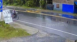 Motorcycle with three people riding bursts into flames
