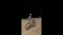 Cyclist bunnyhops bike without using hands