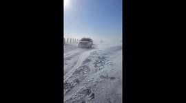 Cars stranded on highway during snow storm in China