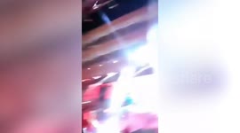 Popular indian singer strikes man with mic and throws his phone in crow