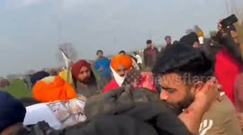 Protesting farmer in India carried off after by struck in head by rubber bullet