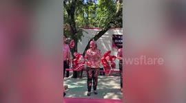 Teachers covered in Valentine's Day heart stickers from students at school event
