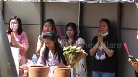 Superstitious Thai women flock to shrines to pray for a lover on Valentine's Day
