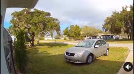 Wild Winds Send Trampoline On Top of Sedan