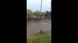 Flooded streets turn into fun waterways: Cordoba resident floats on flood water