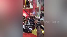 Superstitious fisherman's fishing rods are blessed at local Buddhist temple