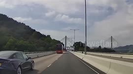 Double decker bus rams into car along Hong Kong highway