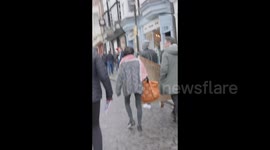 Passerby hurls abuse at protesters in Guildford, UK