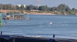 Pickup truck plunges off ferry into river in Thailand