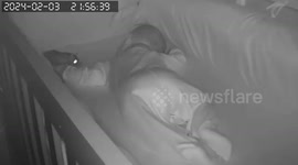 Skin-crawling footage shows rat biting sleeping baby