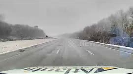 Ambulance Narrowly Avoids Collision During Stormy Weather in Peabody, USA