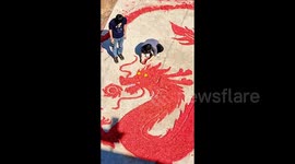 Chinese man transforms spent firecracker paper into majestic Year of the Dragon tribute