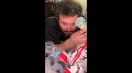 Feeding Baby Clutches Dad's Beard