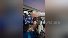 Passenger travel by train toilet for heavy crowd inside train to catch at Charbagh Railway station, Lucknow in India