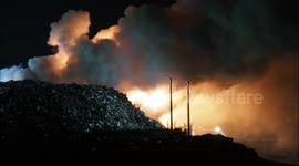 Fire at Sheerness Docks recycling facility in Kent, UK continues into the night