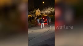 Car flips and narrowly avoids man's head after reversing at speed towards him