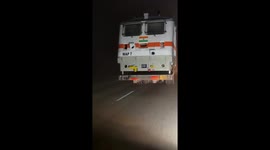 Amazing seen on the road; Train runs on a road in India