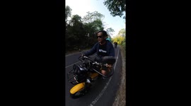 Angry wild elephant chases away couple riding motorbike