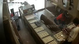 Terrifying moment robbers carrying knife loot jewellery shop after stabbing store owner