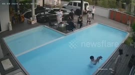 Hero youngster jumps into swimming pool to save pet dog