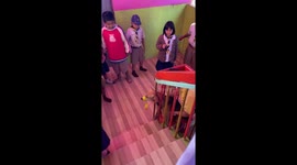 Teacher releases stray dog stuck in school stairs handrail