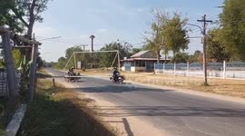 Moving the goalposts...literally! Motorists carry goal along narrow road in Thailand